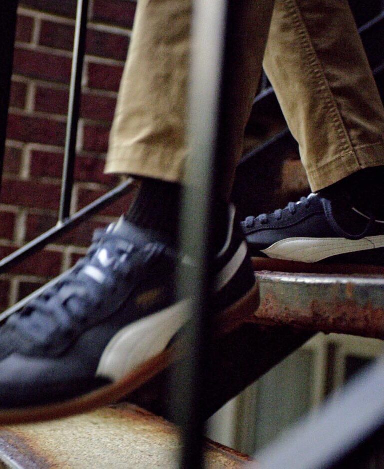 Closeup photo of Puma shoes going down stairs