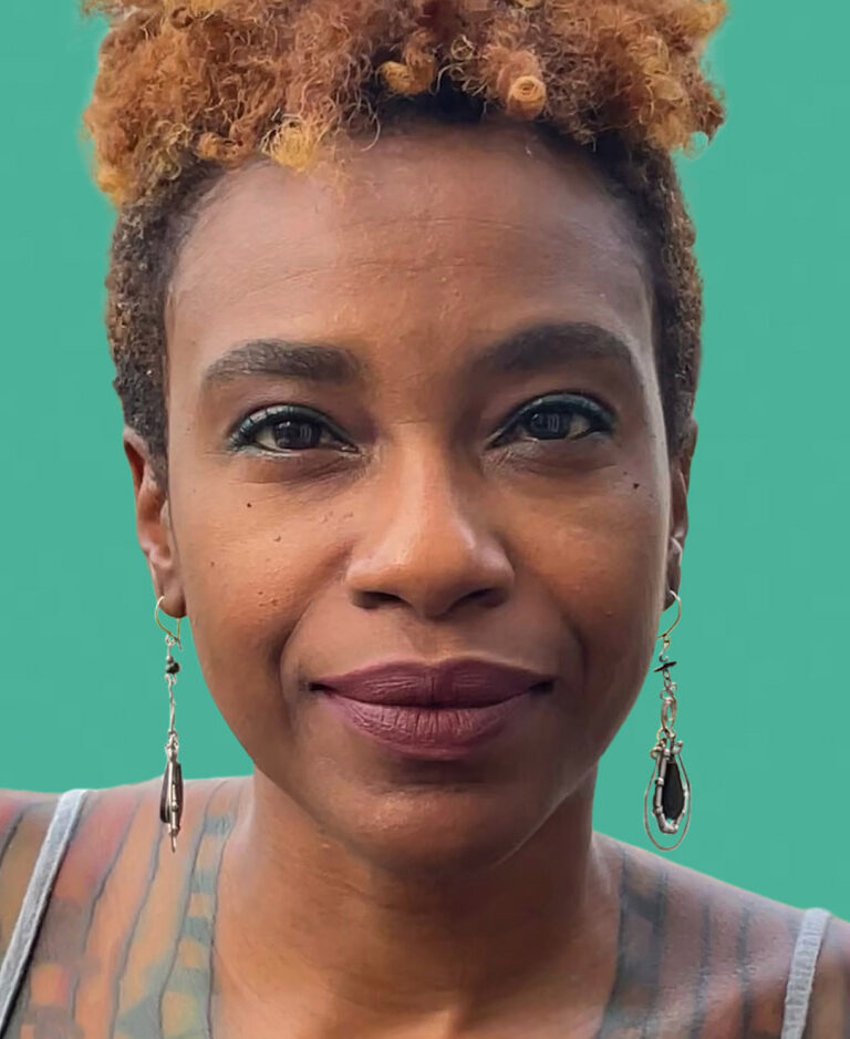Headshot of Akilah Richards against a teal background