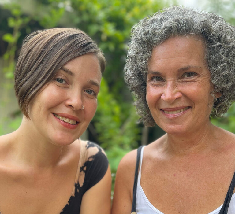 Sari González and Becka Koritz smiling at the camera.